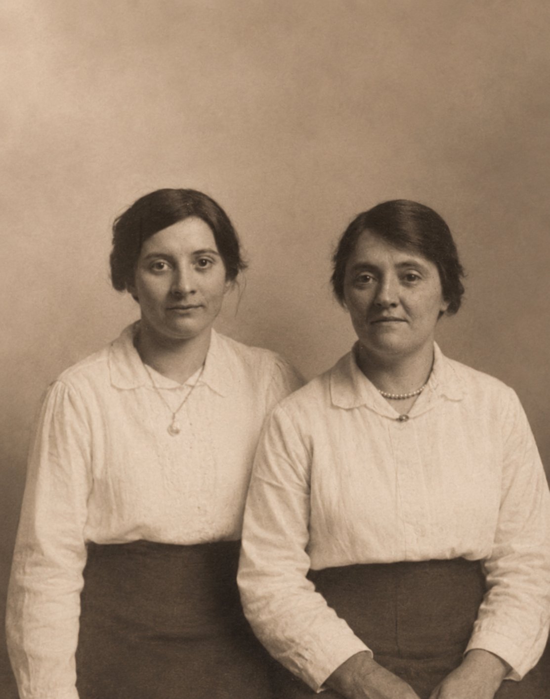Restored vintage portrait of the same two women